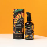 Black Gram Face & Body Duo: the Balaayah Black Gram Body Booster bottle and tube against an orange wall. Label: rich body massage oil for robust, velvety skin, balances vata dosha, 3.38 fl oz (100 ml)