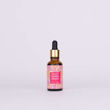 Kesaradi Daily Glow Oil: the amber dropper bottle with a gold collar and a pink flower-print label, on a white background. Label: Kesaradi Oil. Ayurveda's skin brightening, revitalizing, uber-nourishing secret. A signature blend of precious saffron + rose + turmeric + 16 Ayurvedic herbs. iYURA