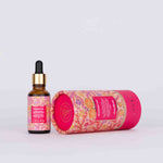 Kesaradi Daily Glow Oil: the dropper bottle standing beside its tube lying on its side, on a white background. Label: Kesaradi Oil, 1 fl oz (30 ml)
